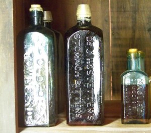 From left: Old Dr. J. Townsend's Sarsaparilla (a type of bitters and ancestor of modern-day root beer), Dr. J. Hostetter's Stomach Bitters, and a medicine manufactured by Maguire Druggist in St. Louis, MO